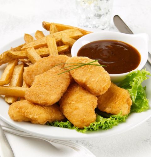 Pépites de poitrine de poulet, escalopettes de poulet, panées, épicées, non cuites
