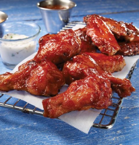 Ailes de poulet piquantes épicées, coupées, entièrement cuites (assaisonnées)