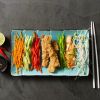 Breaded boneless chicken breast fingers, halal (seasoned, parfried)